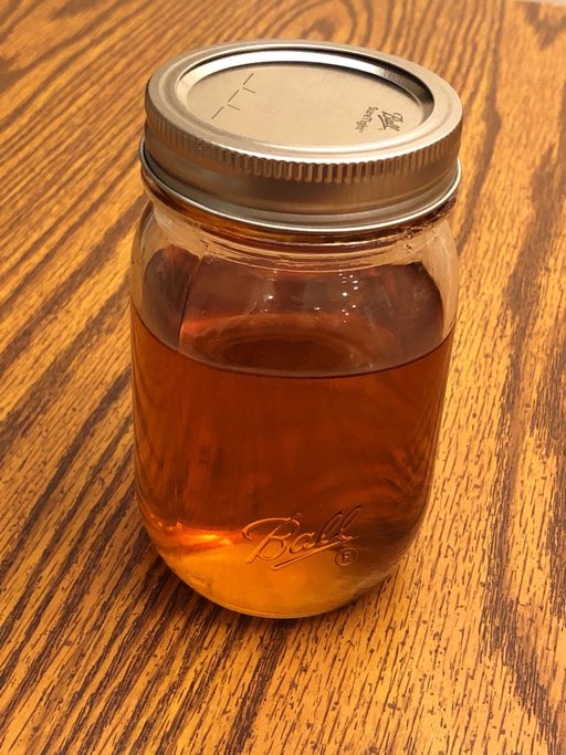 Finished maple syrup in a mason jar